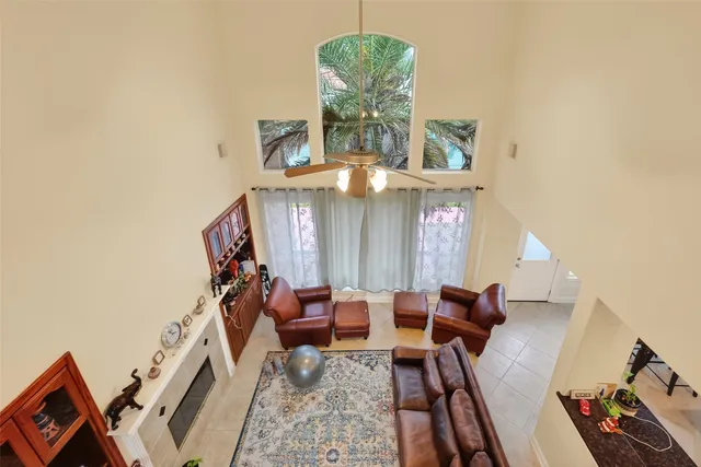 a view of a livingroom with furniture and a window
