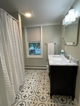 a bathroom with a sink and a mirror