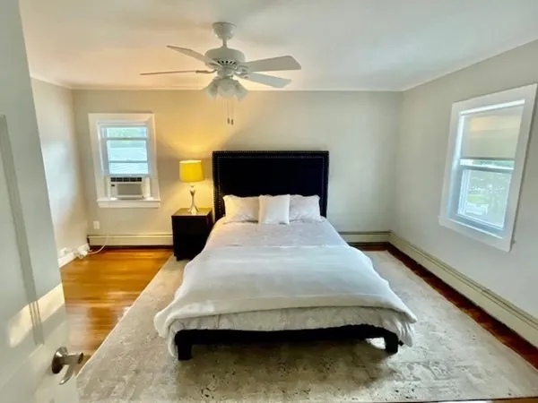 a bedroom with a bed and window