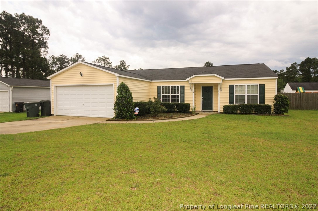 6377 Overhills Road Spring Lake, NC 28390 - Photo 2 of 29 a front view of a house with a yard