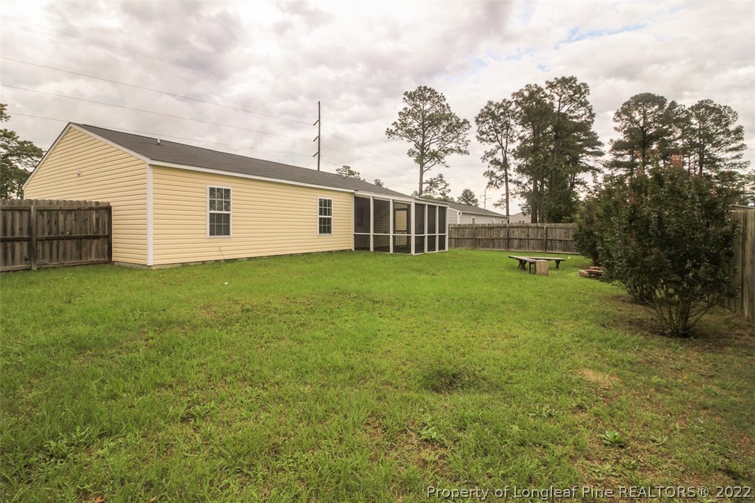 6377 Overhills Road Spring Lake, NC 28390 - Photo 29 of 29 a view of a house with a yard and trees