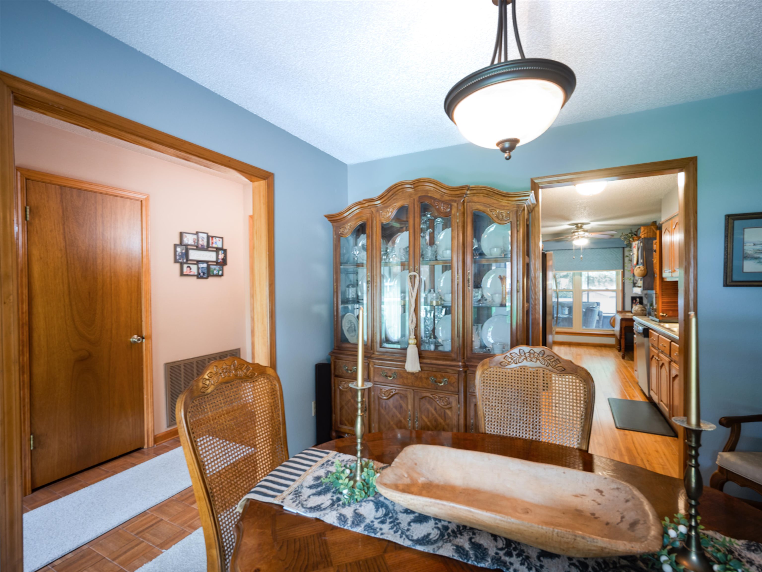 65 Paulette Circle Covington, TN 38019 - Photo 12 of 33 a living room with furniture a chandelier and wooden floor