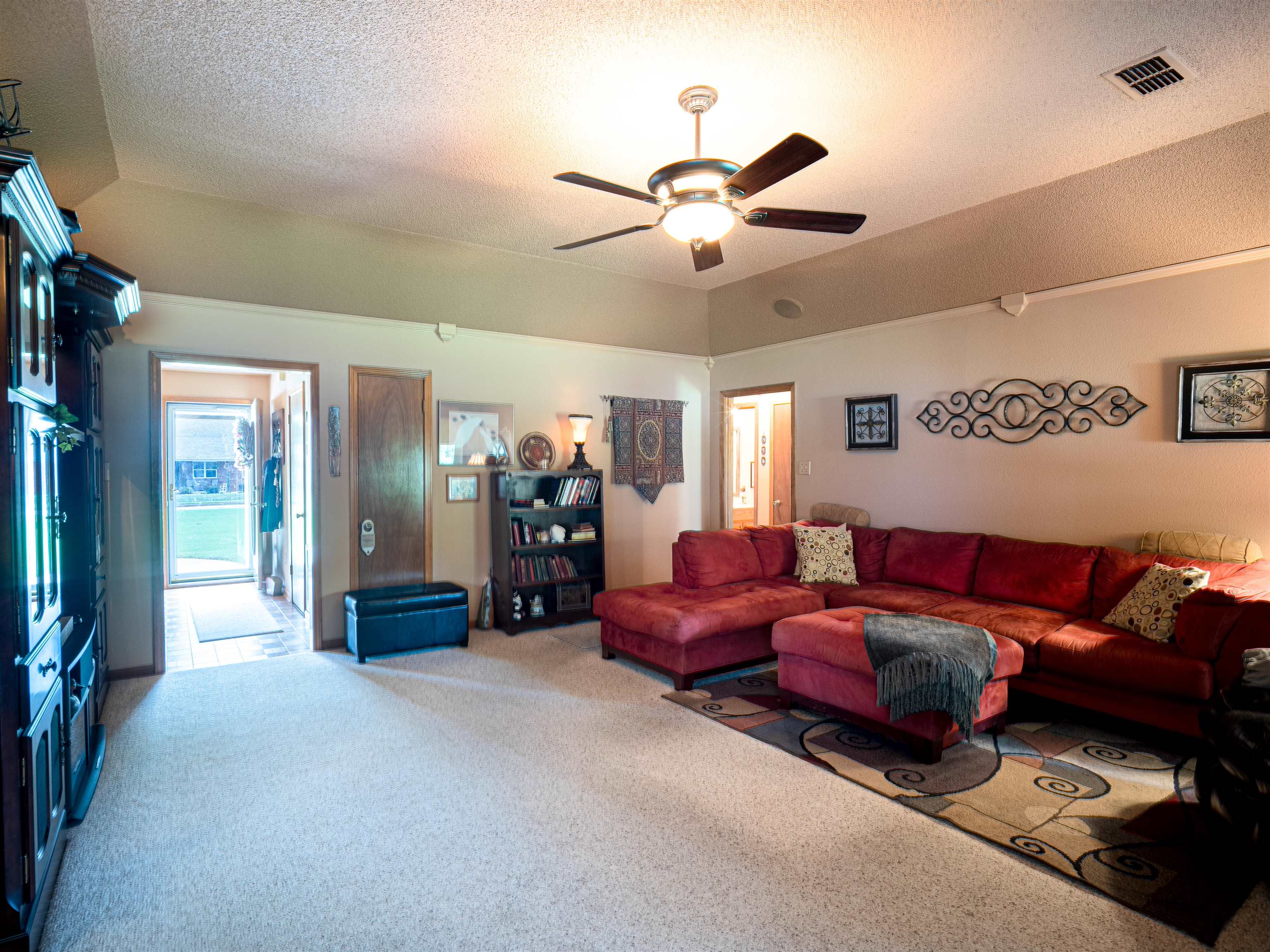 65 Paulette Circle Covington, TN 38019 - Photo 16 of 33 a living room with furniture and a chandelier