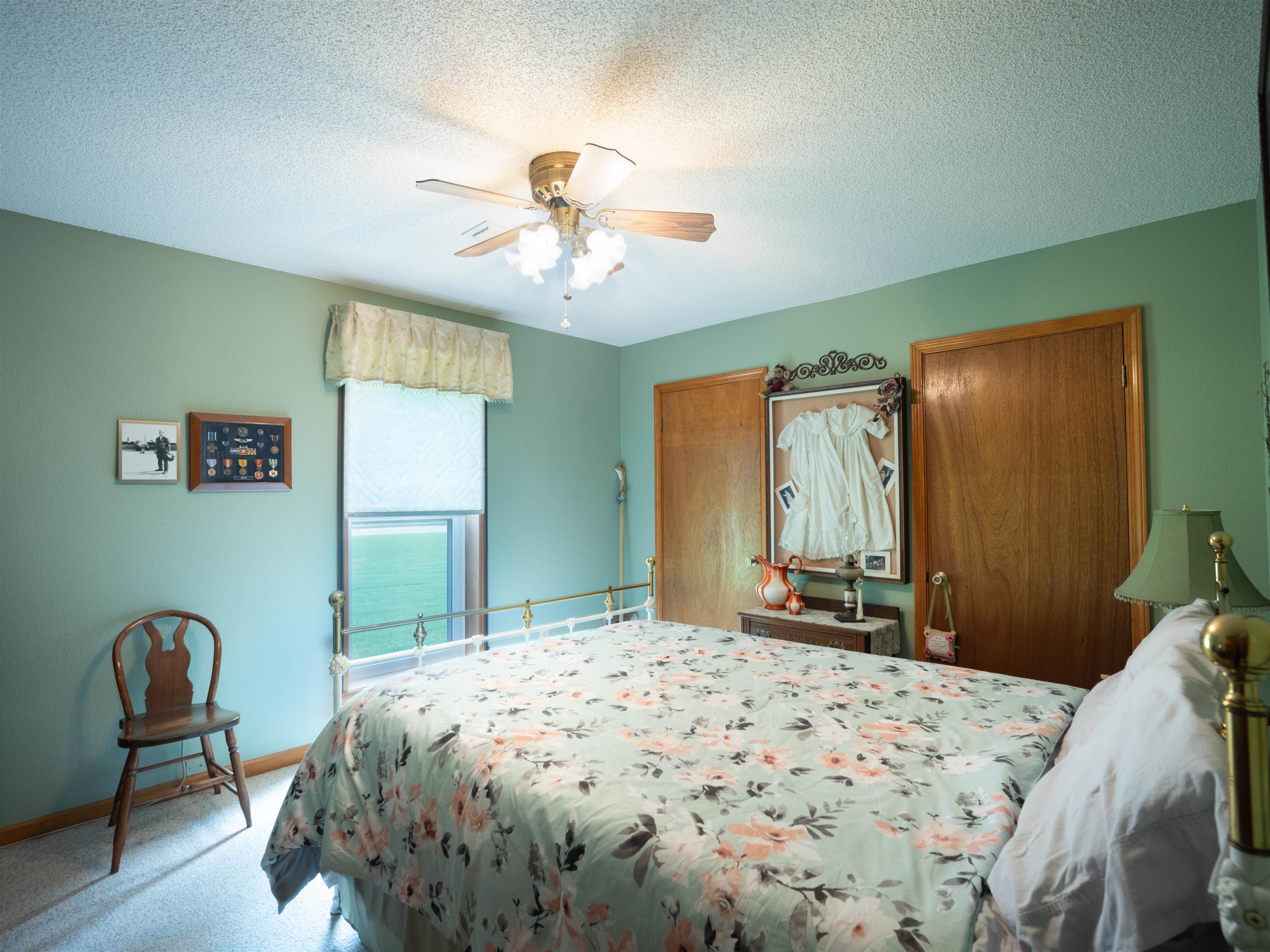 65 Paulette Circle Covington, TN 38019 - Photo 17 of 33 a bedroom with a bed and a chandelier