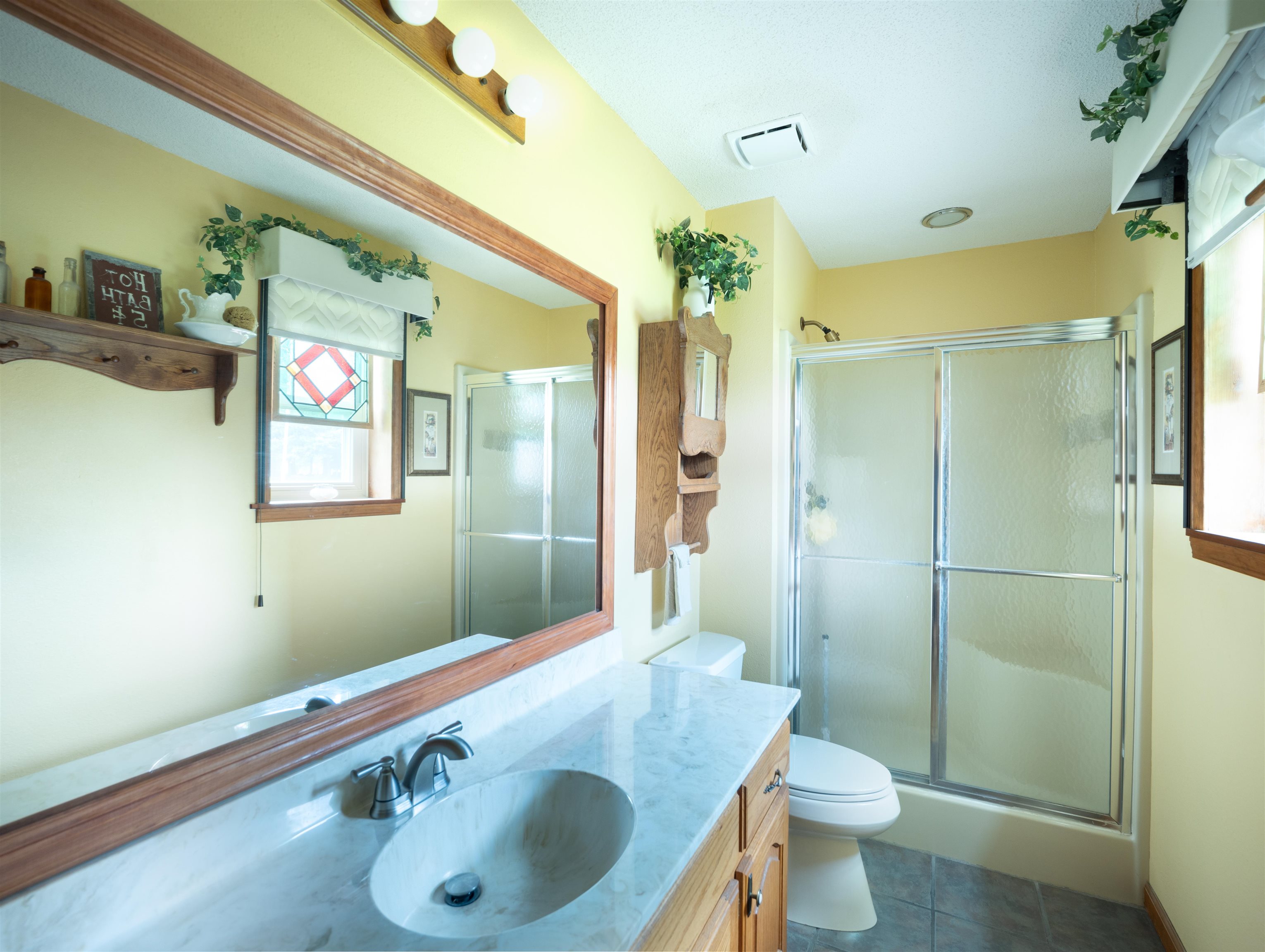 65 Paulette Circle Covington, TN 38019 - Photo 20 of 33 a bathroom with a sink a toilet and shower
