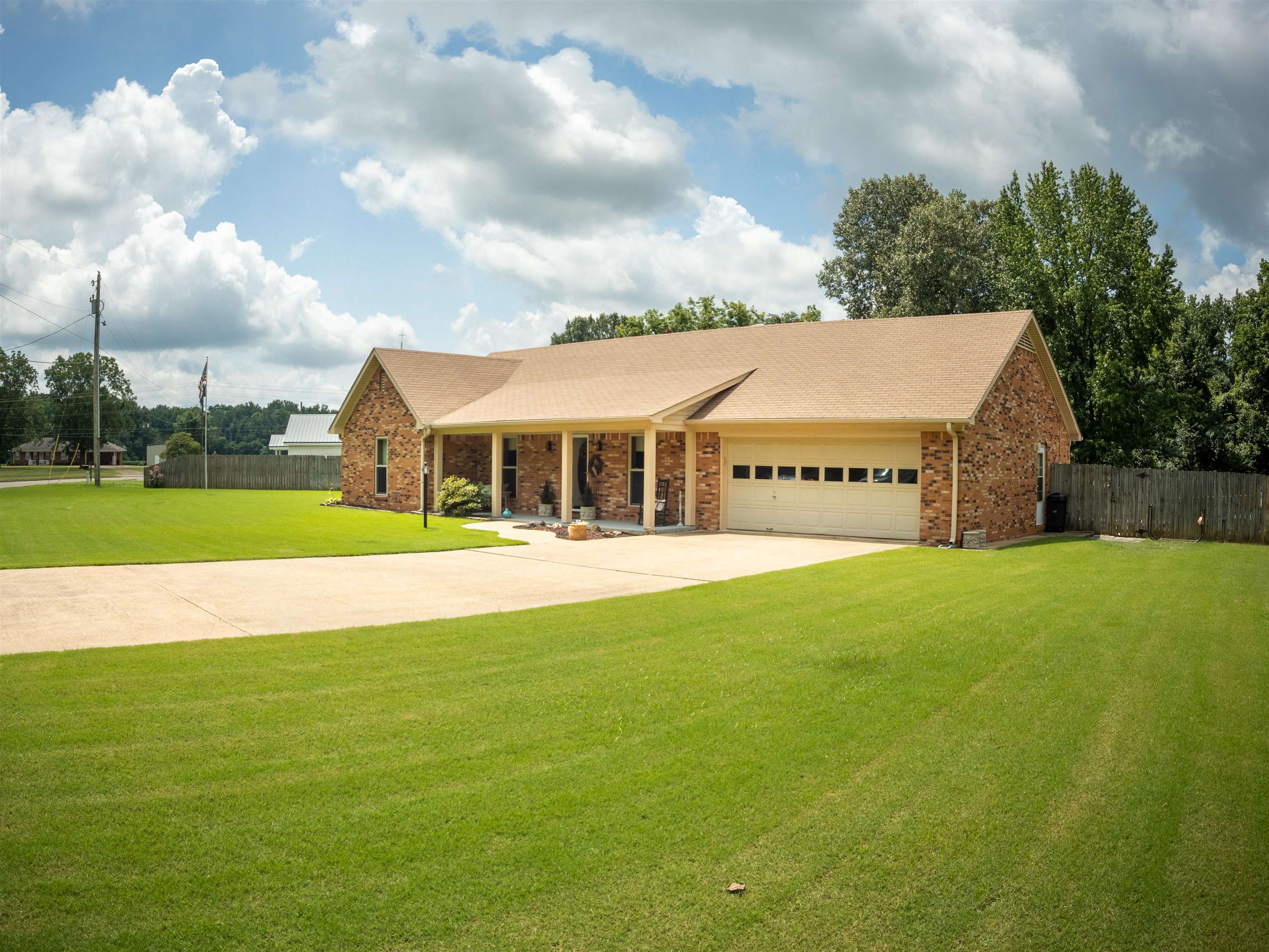 65 Paulette Circle Covington, TN 38019 - Photo 2 of 33 a view of an house with backyard and pool
