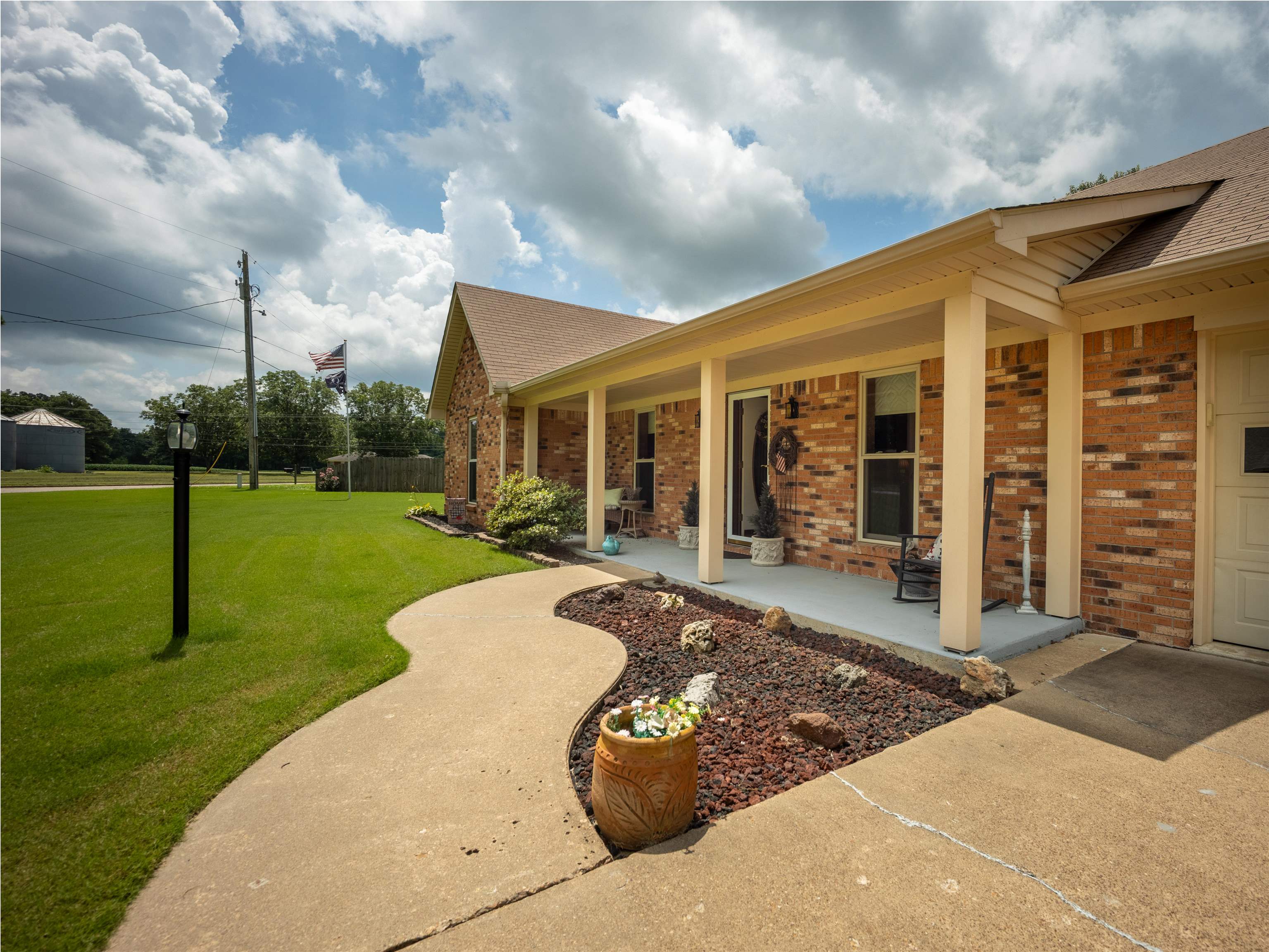 65 Paulette Circle Covington, TN 38019 - Photo 3 of 33 a view of a house with backyard porch and entertaining space