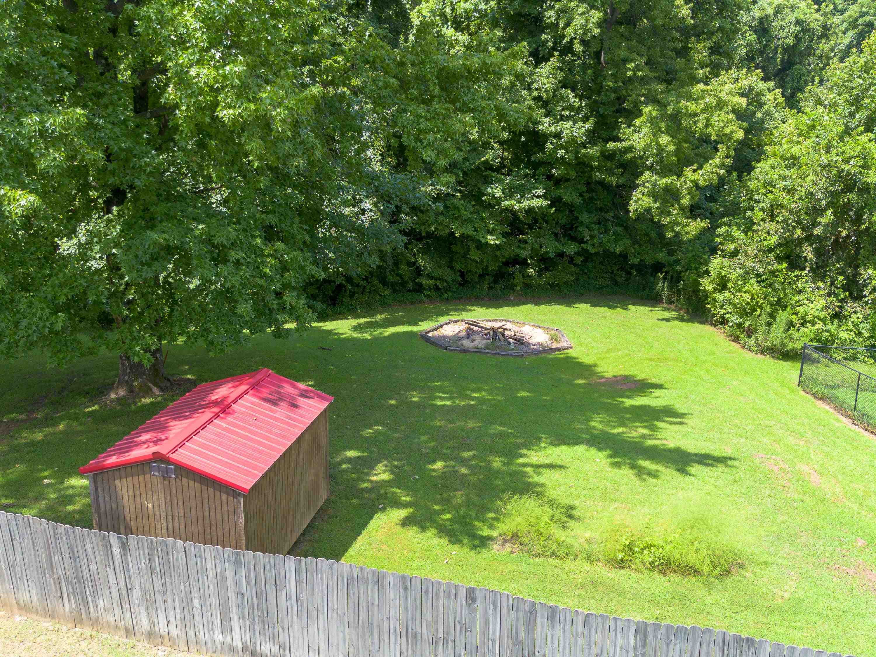 65 Paulette Circle Covington, TN 38019 - Photo 31 of 33 a view of a wooden deck and a yard
