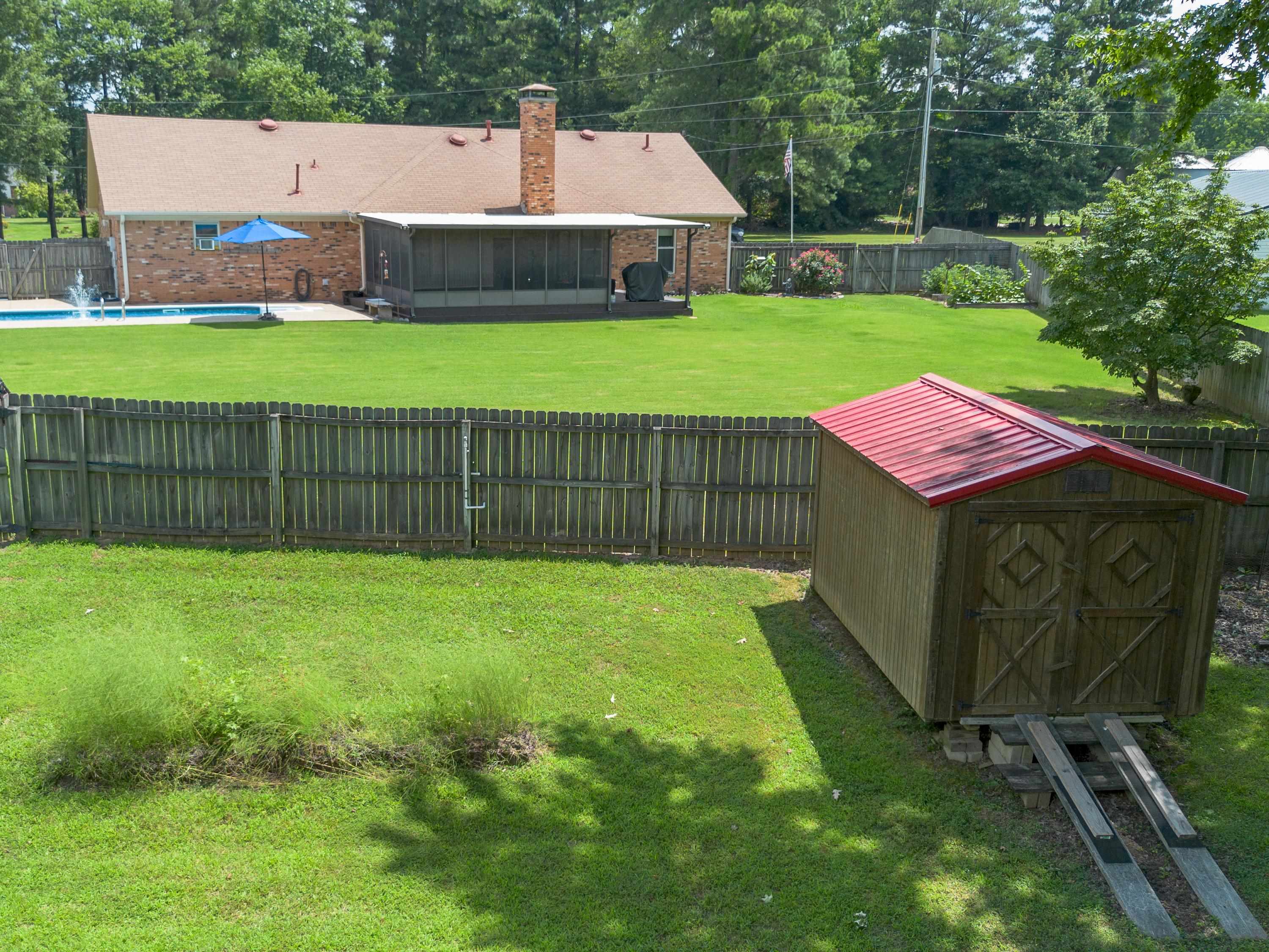 65 Paulette Circle Covington, TN 38019 - Photo 32 of 33 a view of a house with a backyard