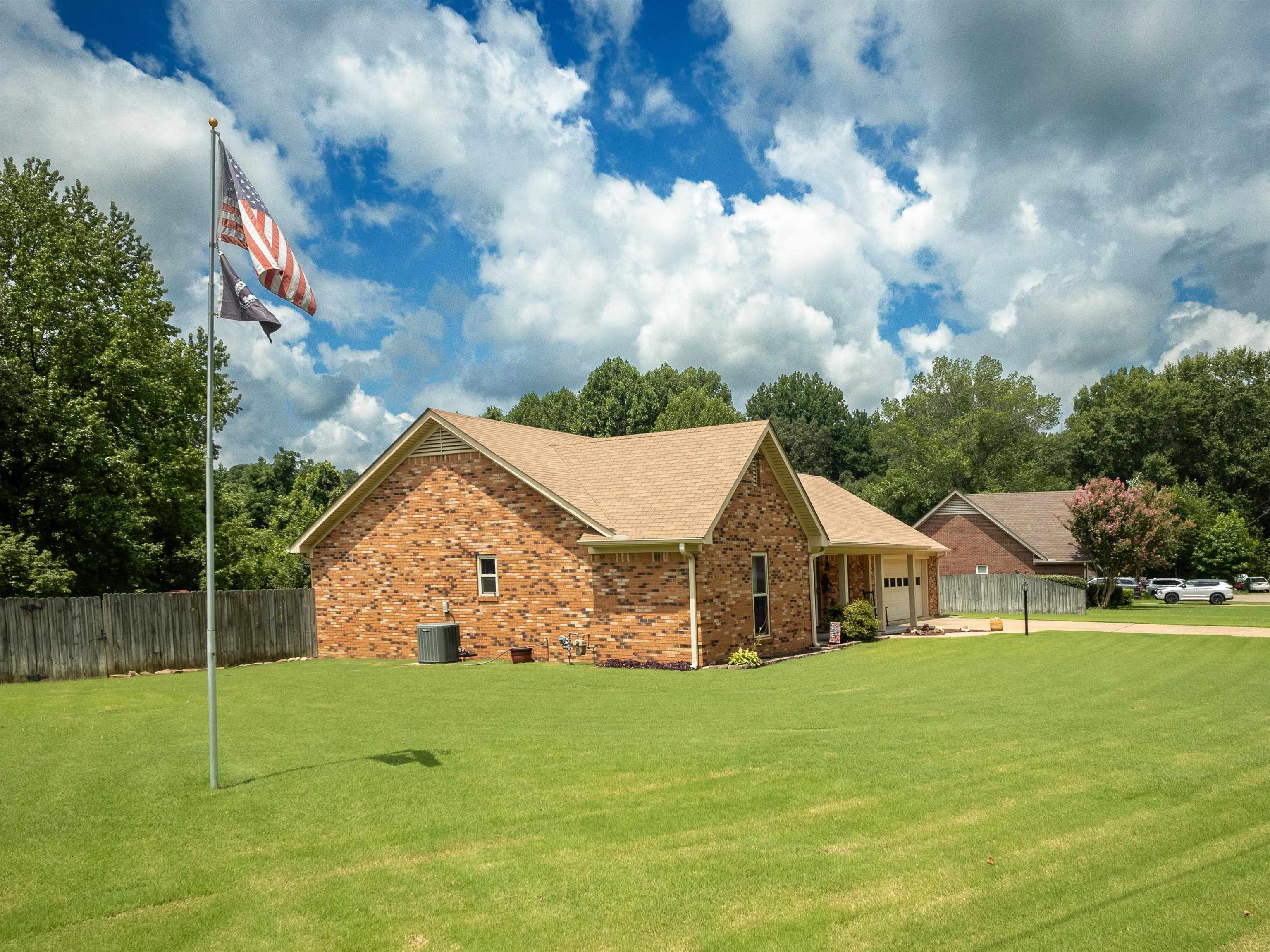 65 Paulette Circle Covington, TN 38019 - Photo 8 of 33 a view of house with garden and entertaining space