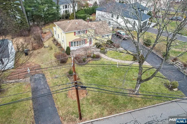 a view of a balcony with yard