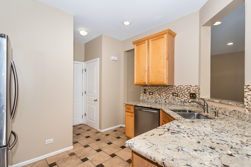 3160 Bromley Lane Aurora, IL 60502 - Photo 4 of 15 a bathroom with a sink a toilet and shower
