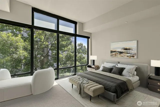 a bedroom with a bed and a large window