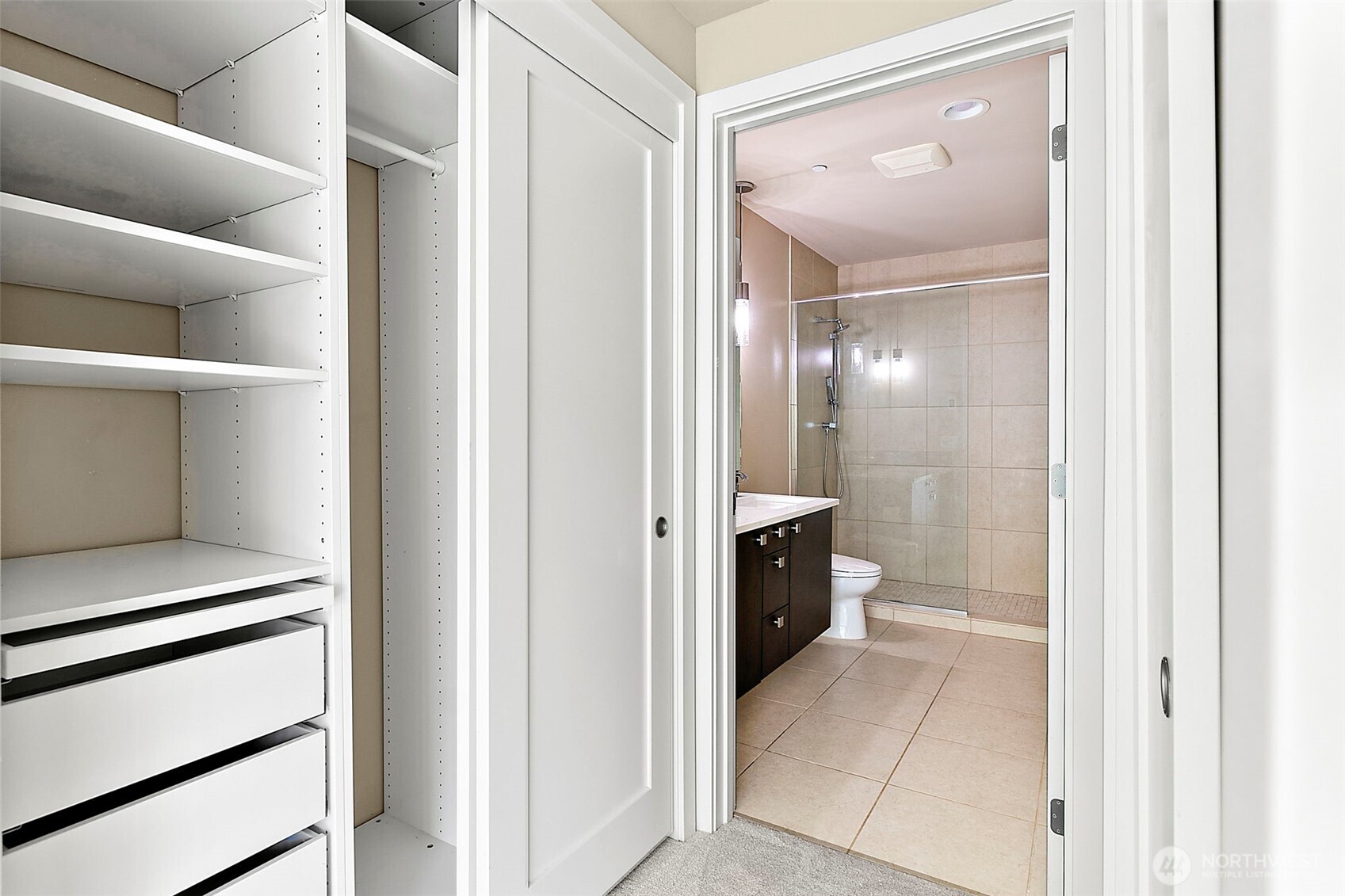 10000 Main Street, Unit 504 Bellevue, WA 98004 - Photo 15 of 37 a view of a hallway with closet and a living room