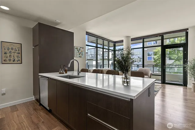 a kitchen with a sink and large window