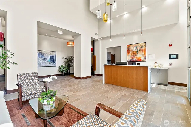 a living room with patio furniture and a potted plant