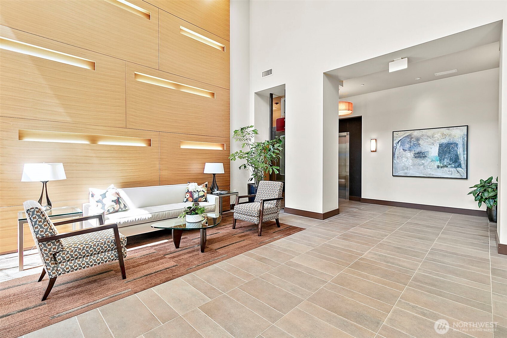 10000 Main Street, Unit 504 Bellevue, WA 98004 - Photo 24 of 37 a living room with patio furniture and a potted plant
