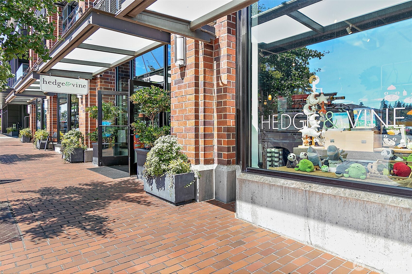 10000 Main Street, Unit 504 Bellevue, WA 98004 - Photo 29 of 37 a view of a house with a garden