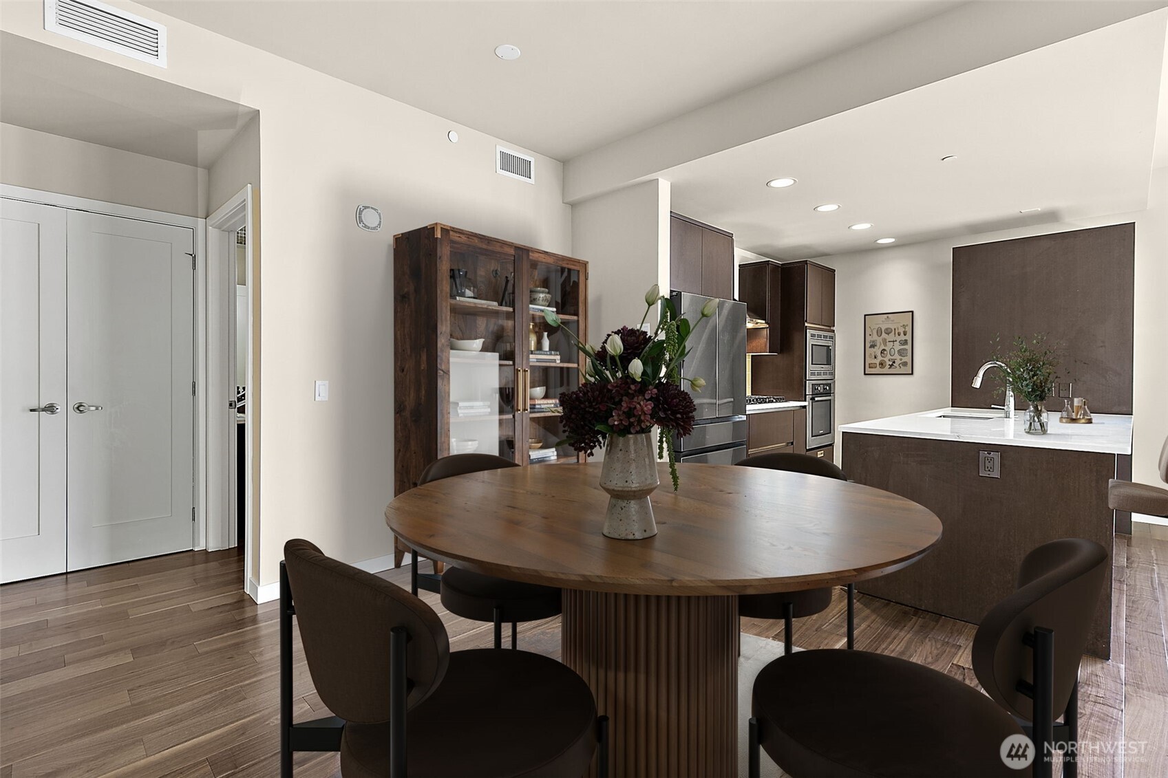 10000 Main Street, Unit 504 Bellevue, WA 98004 - Photo 4 of 37 a view of a dining room with furniture