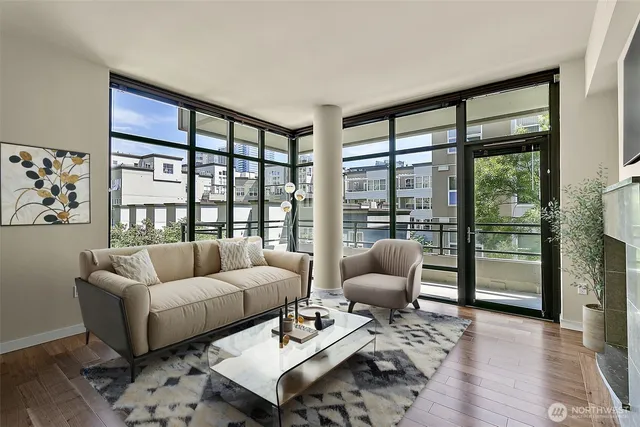 a living room with furniture and a large window