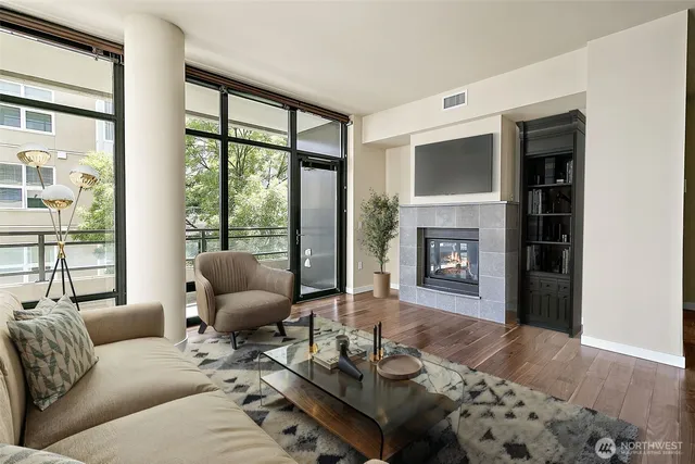 a living room with furniture and a fireplace