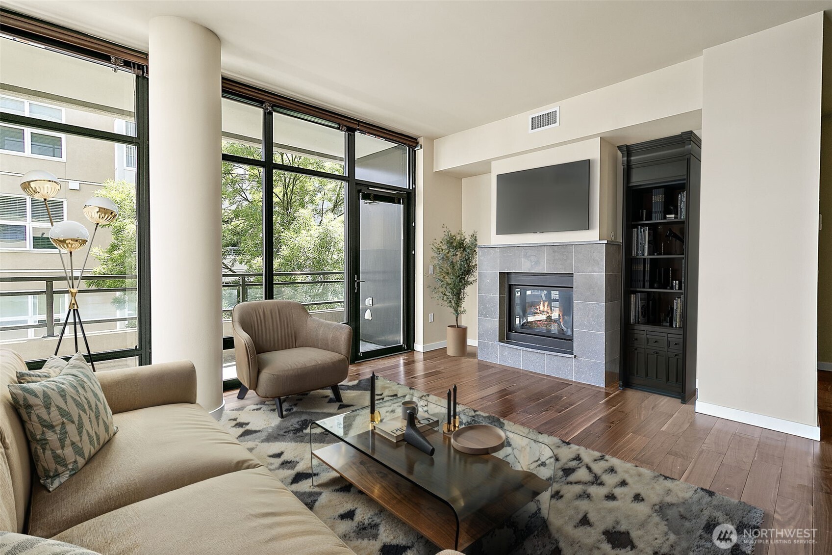 10000 Main Street, Unit 504 Bellevue, WA 98004 - Photo 9 of 37 a living room with furniture and a fireplace