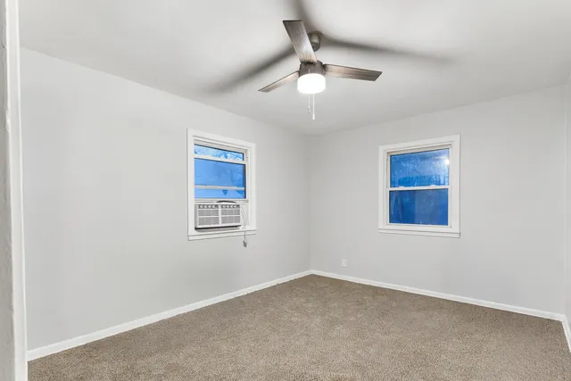 an empty room with windows