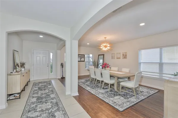 a living room with a rug and a table
