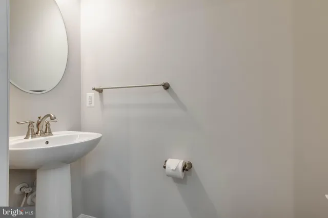 a bathroom with a sink and mirror