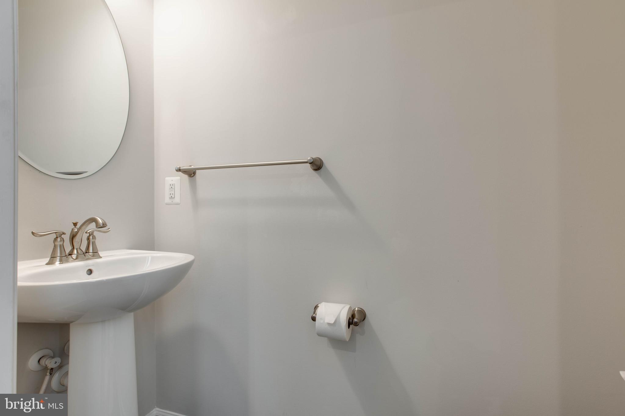 3004 Cornfield Avenue Hanover, MD 21076 - Photo 11 of 50 a bathroom with a sink and mirror