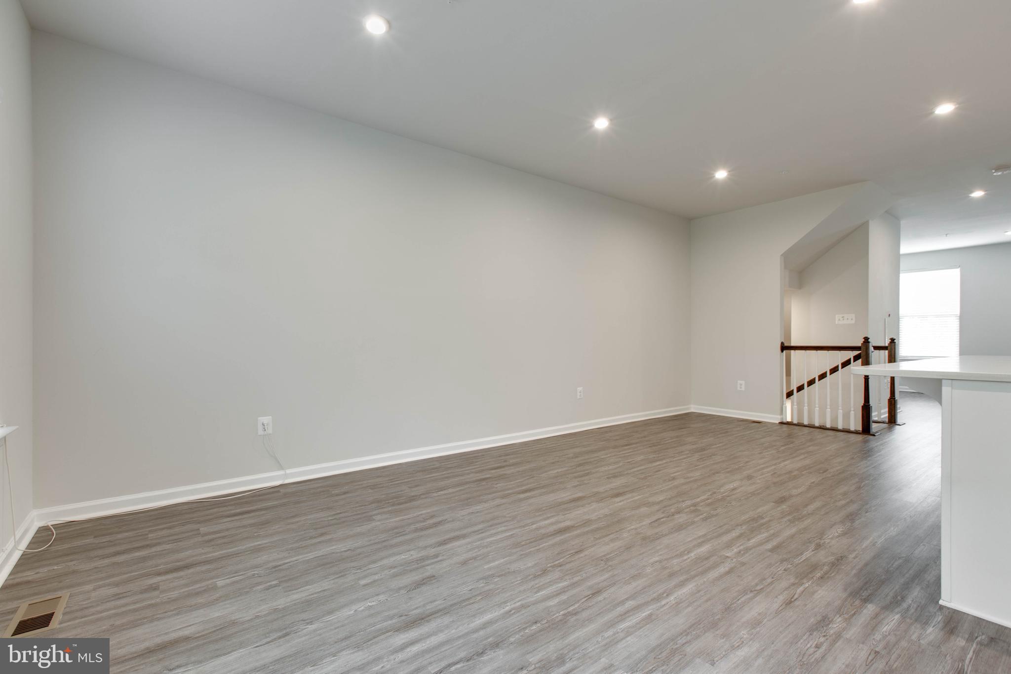 3004 Cornfield Avenue Hanover, MD 21076 - Photo 13 of 50 a view of empty room with wooden floor