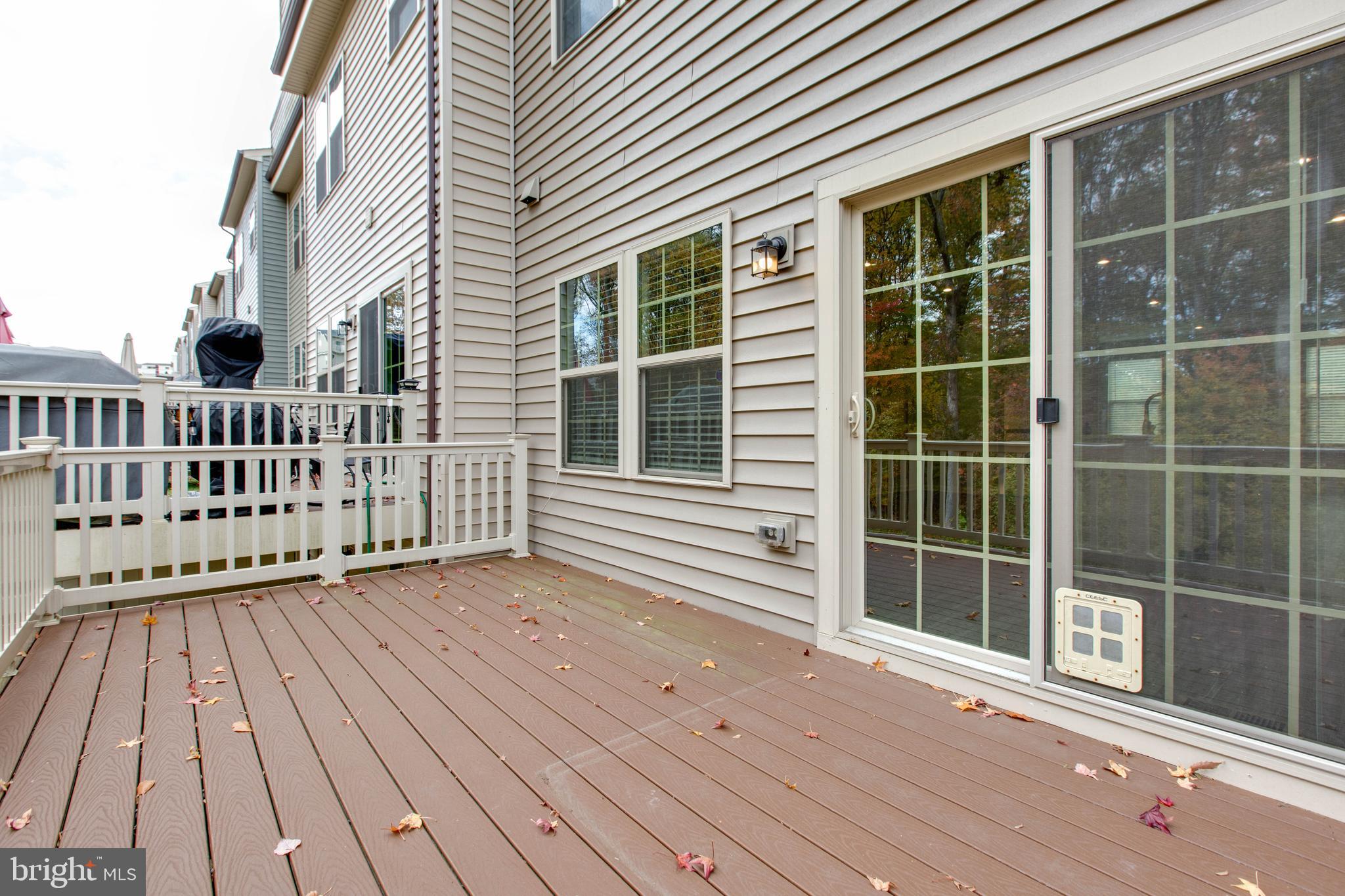 3004 Cornfield Avenue Hanover, MD 21076 - Photo 20 of 50 a view of a house with a wooden deck