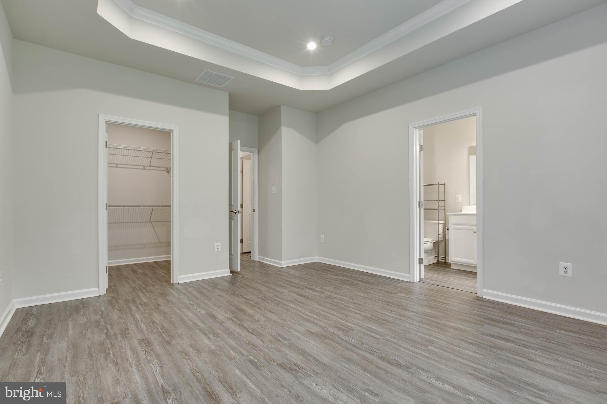 3004 Cornfield Avenue Hanover, MD 21076 - Photo 26 of 50 an empty room with wooden floor & closet and windows