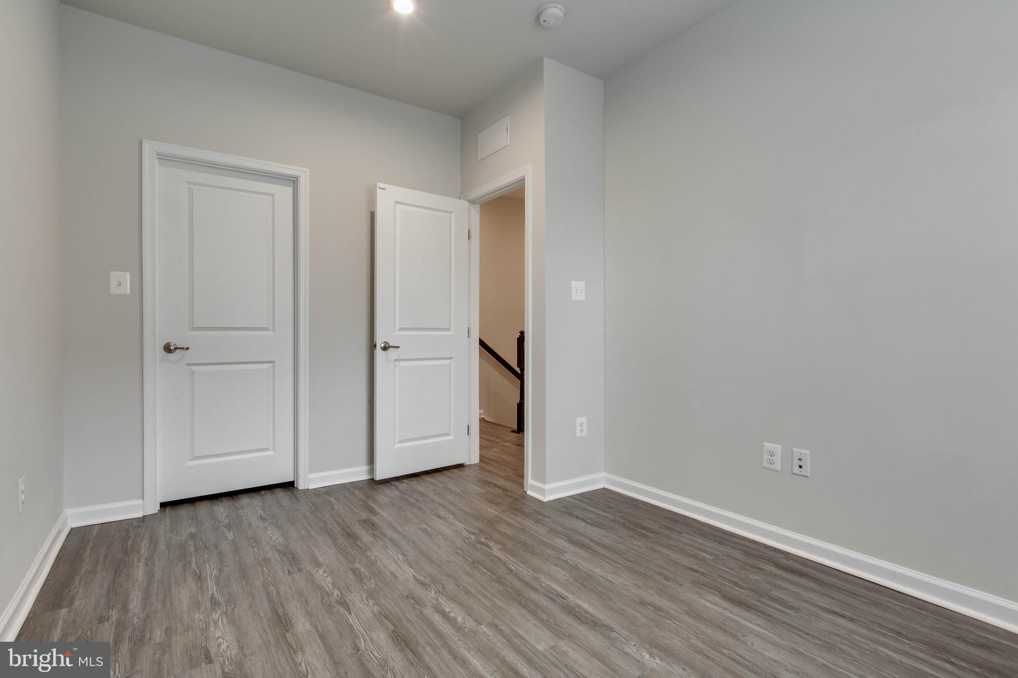 3004 Cornfield Avenue Hanover, MD 21076 - Photo 31 of 50 a view of an empty room with wooden floor and closet