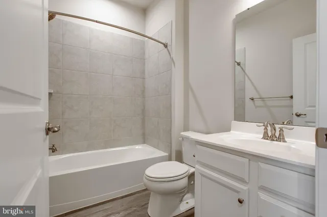a bathroom with a sink a toilet and a bathtub