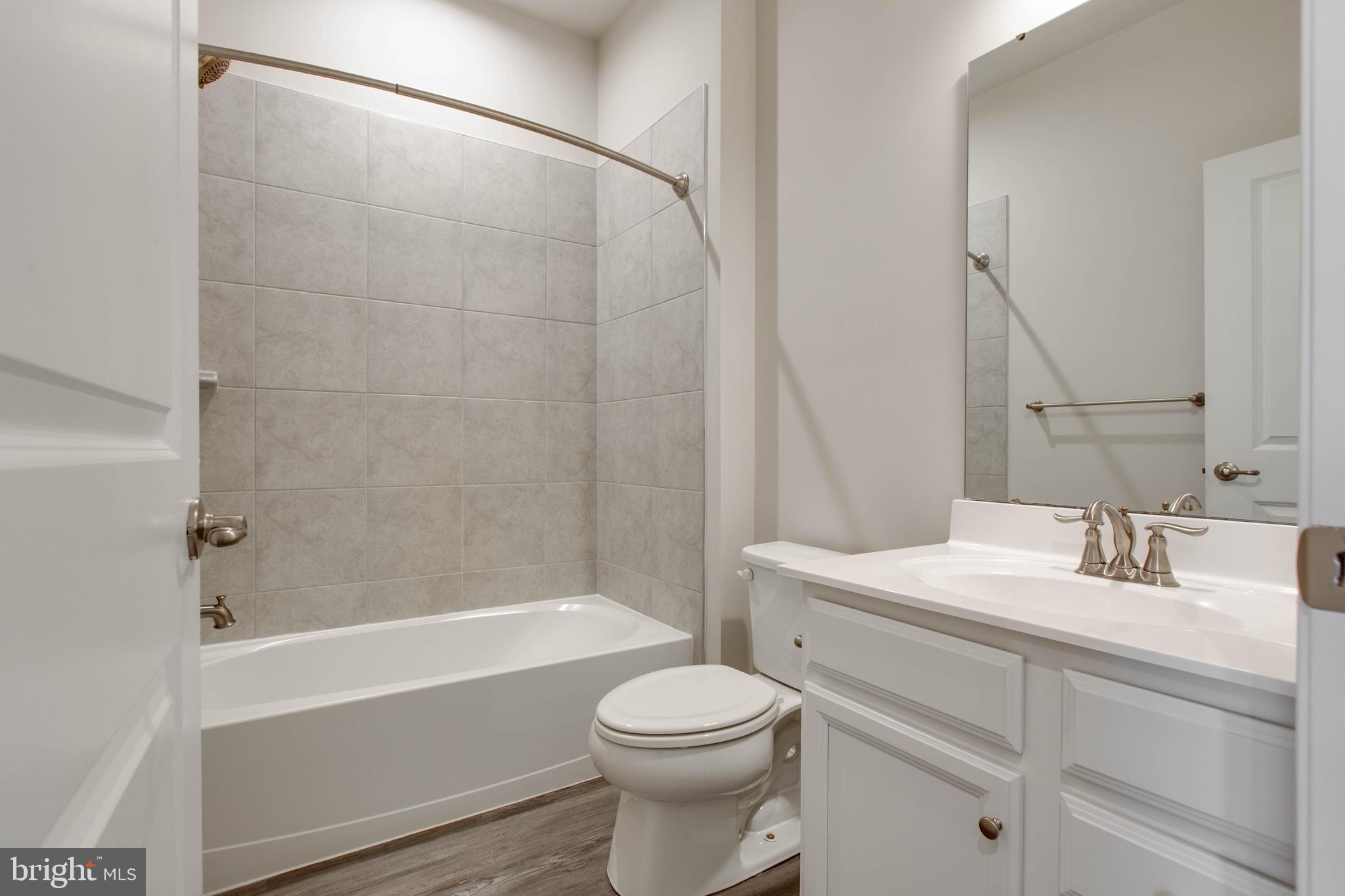 3004 Cornfield Avenue Hanover, MD 21076 - Photo 33 of 50 a bathroom with a sink a toilet and a bathtub