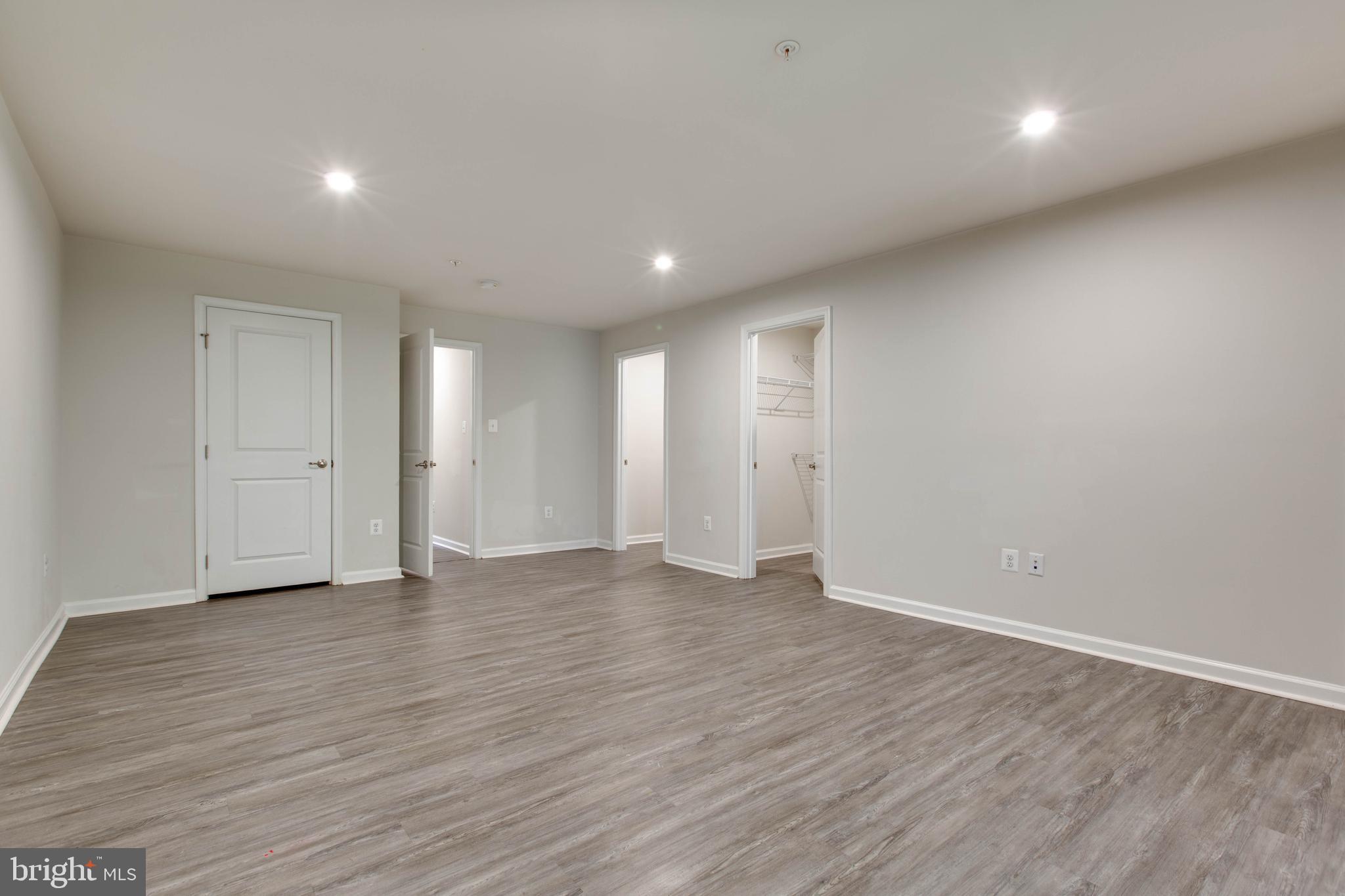 3004 Cornfield Avenue Hanover, MD 21076 - Photo 41 of 50 a view of an empty room with wooden floor
