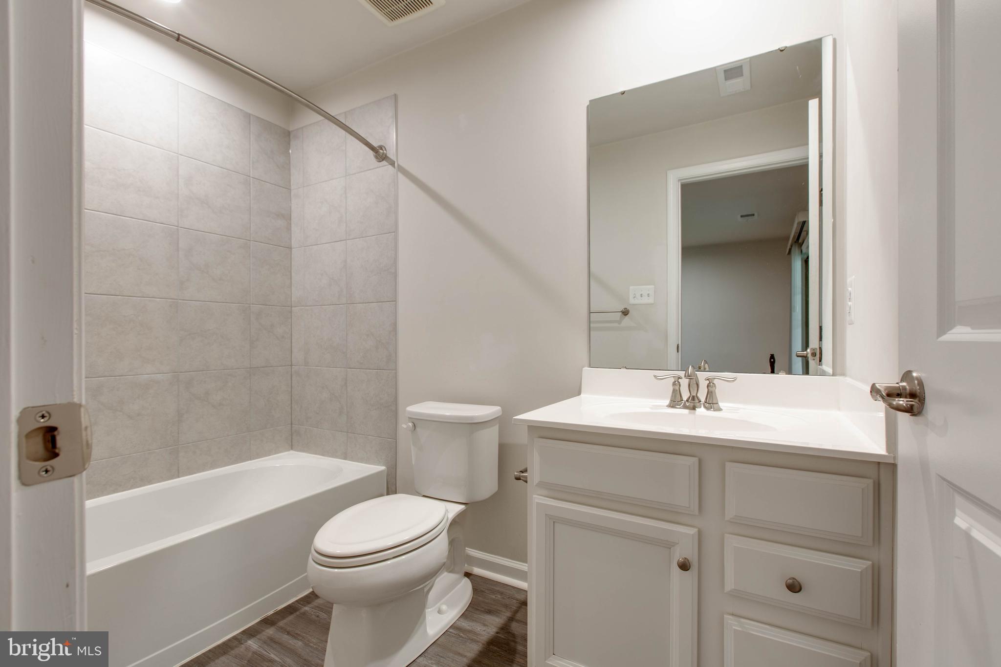 3004 Cornfield Avenue Hanover, MD 21076 - Photo 43 of 50 a bathroom with a sink a toilet and shower