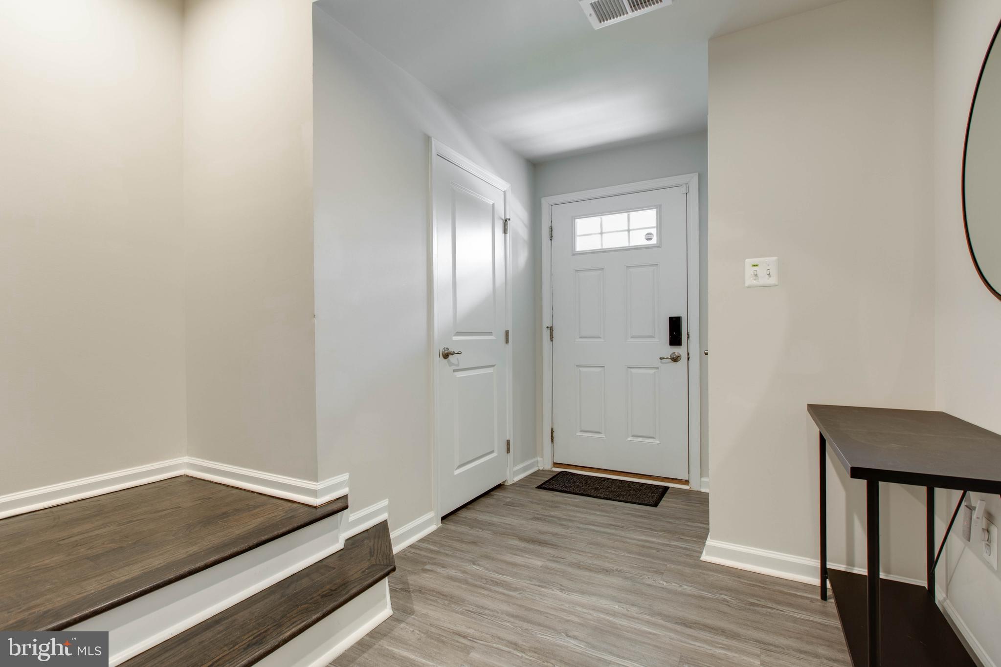 3004 Cornfield Avenue Hanover, MD 21076 - Photo 5 of 50 a view of a livingroom with wooden floor and closet