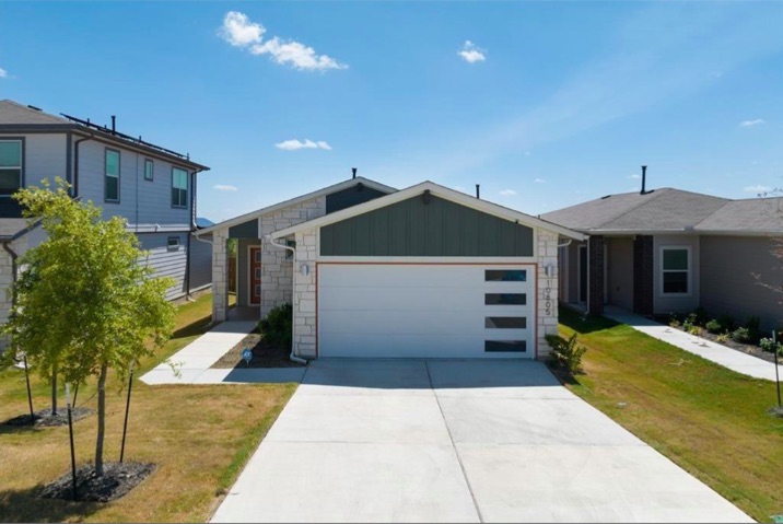 10805 Meris Lane Austin, TX 78754 - Photo 1 of 28 A contemporary one-story home with a clean facade and a spacious driveway, offering appealing curb appeal.