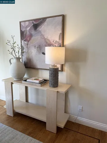 a living room with furniture fireplace and a large window