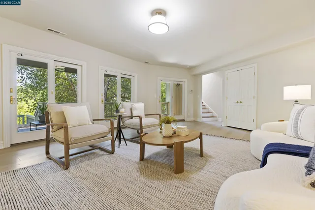 a view of a livingroom with furniture and window