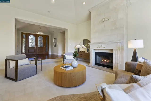 a living room with couches and a potted plant on table