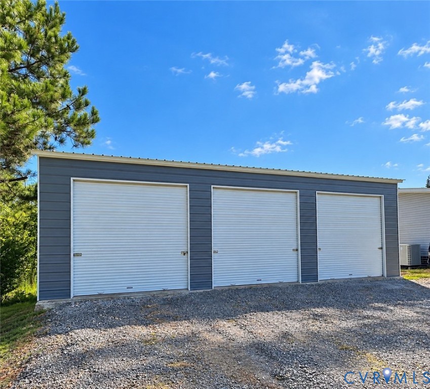 1385 Waltons Store Road Louisa, VA 23093 - Photo 2 of 2 Three-bay garage structure with metal siding and w