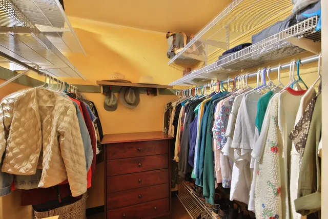 a bathroom with a sink a mirror and a shower