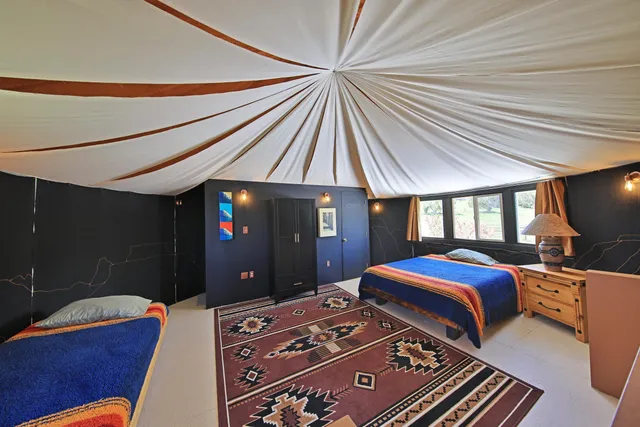 a view of a patio with table and chairs potted plants with sky view