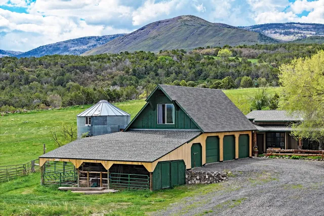 a view of a golf course with chairs