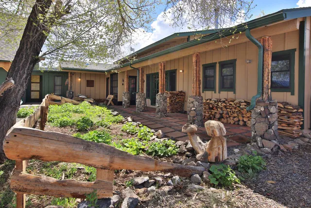 a front view of a house with garden