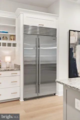 a bath tub sitting in a kitchen next to a window