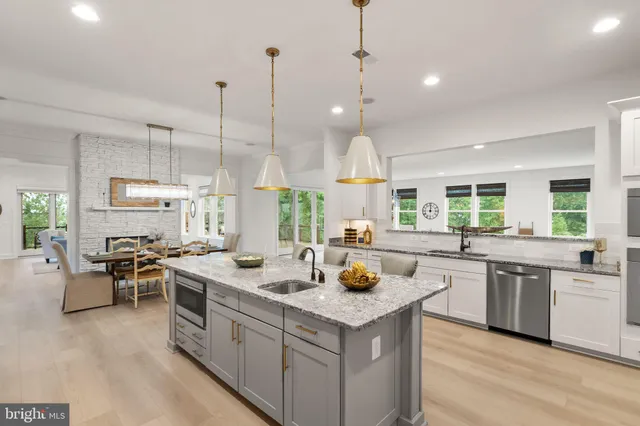 a bed sitting in a bedroom and lamp next to a window